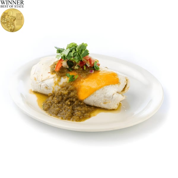 A breakfast burrito covered in green chili sauce, melted cheese, and fresh pico de gallo.